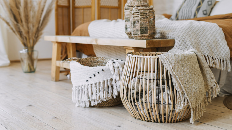 wicker blanket basket in bedroom