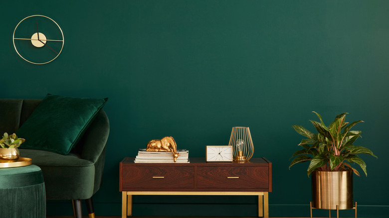 dark green wallpaper and table