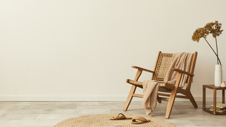 low weaved chair with blanket