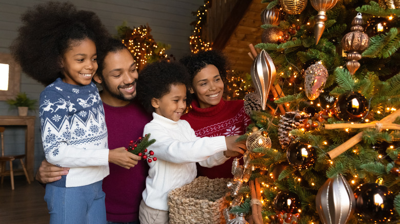 Family decorating tree