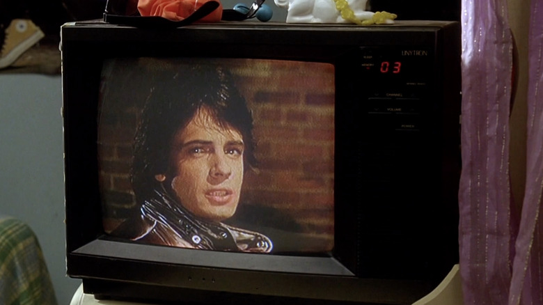 Small tv with Rick Springsteen onscreen 