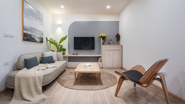 curved sofa and chair in living room