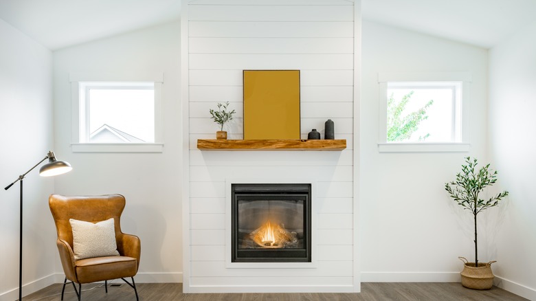 fireplace with wooden mantel
