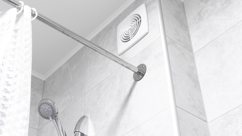 The top of a shower with a vent