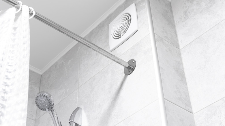 The top of a shower with a vent