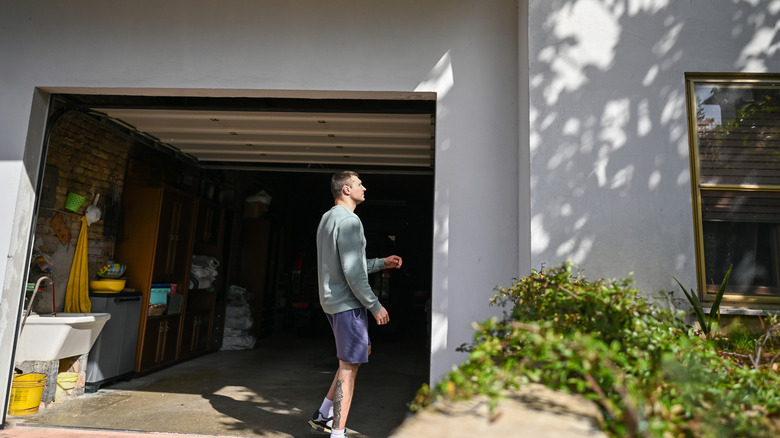 Man walking into his garage