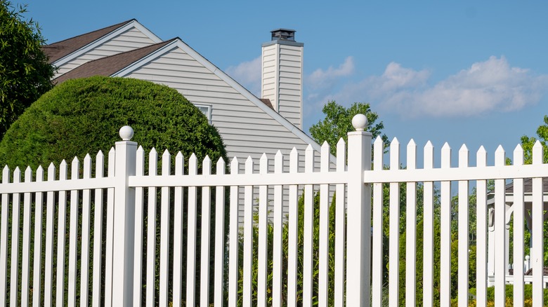 White vinyl fence near house