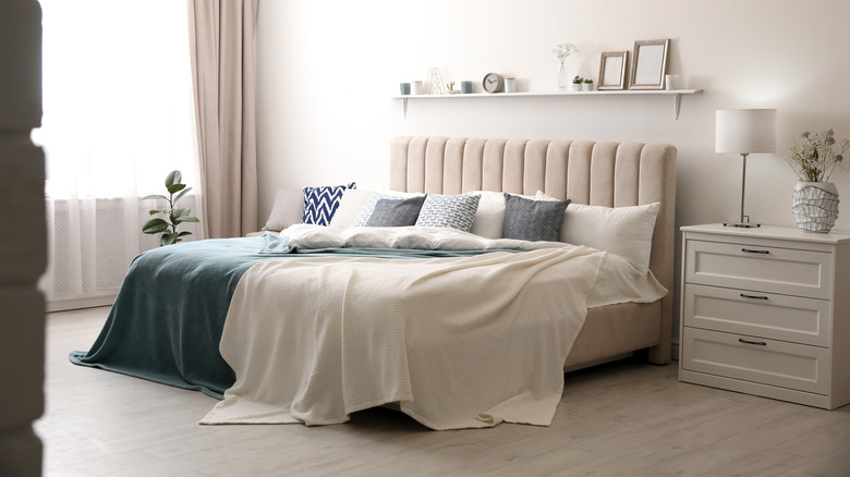 Bedroom with fabric covered headboard