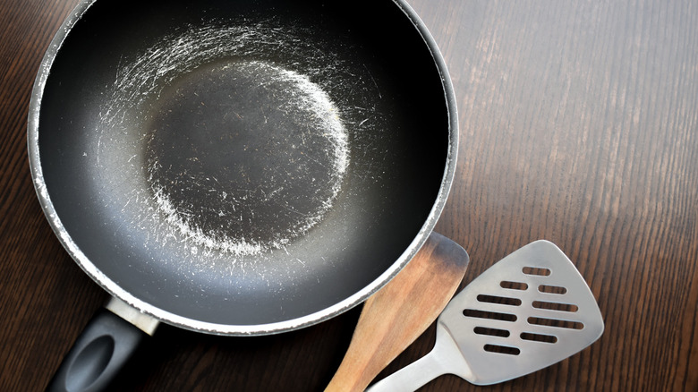 worn out pan on wood table