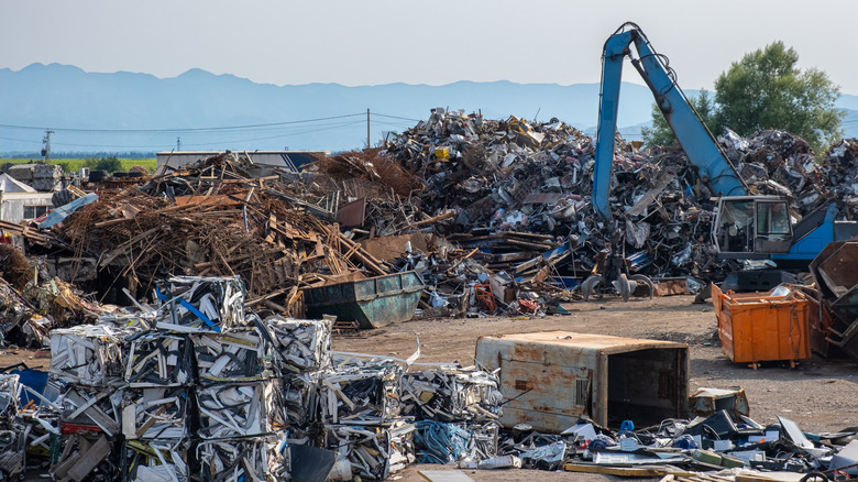 a scrap yard with metal junk and more