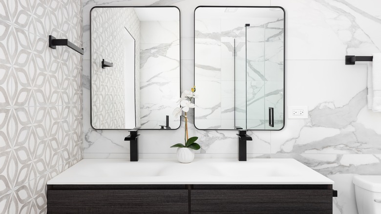An example of a modern double faucet in a master bathroom.