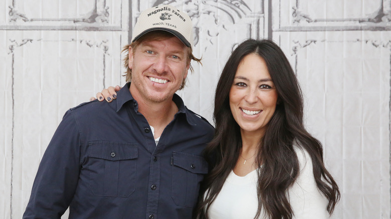 Chip and Joanna Gaines posing at an event