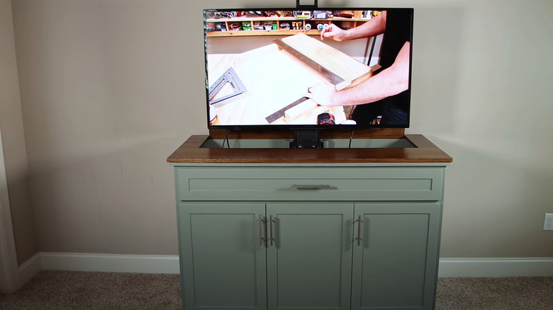 cabinet with tv popped up