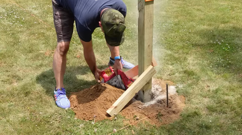 Installing a fence post in concrete