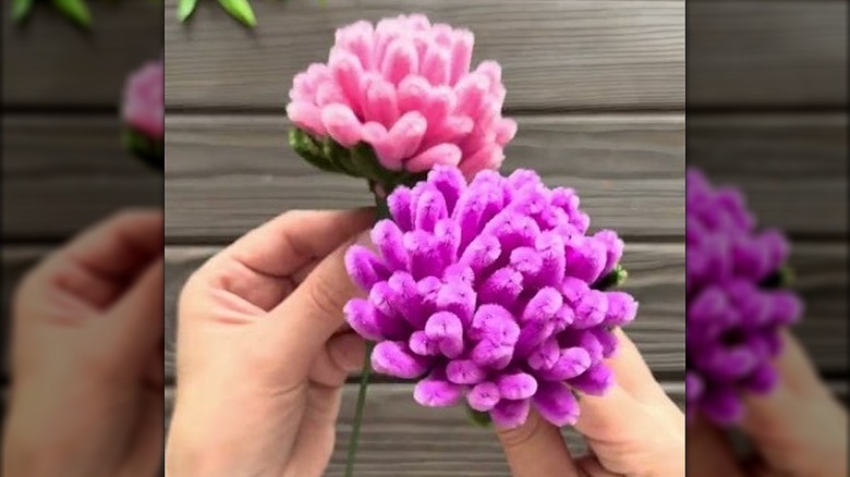 Artificial pink and purple chrysanthemum made from chenille wires.