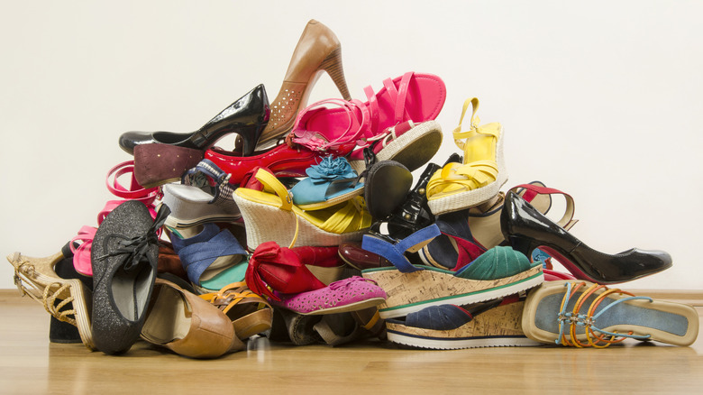 messy pile of shoes on the ground