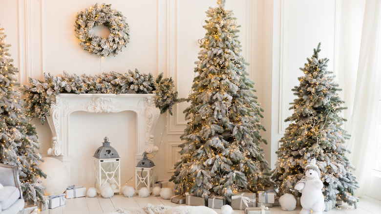 living room with Christmas trees