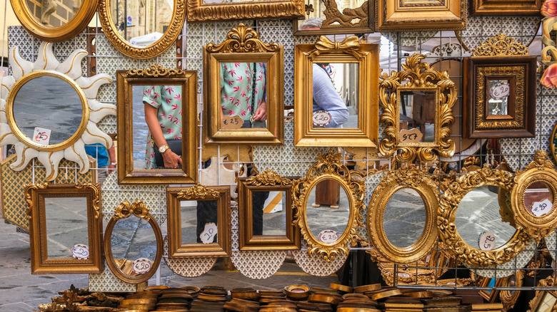 Antique mirrors on display in a flea market