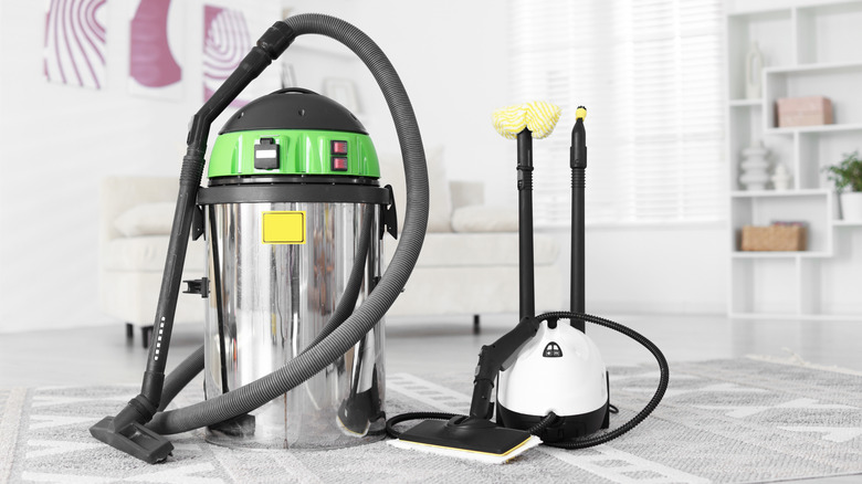 Steam cleaner and vacuum with holster sitting on a rug