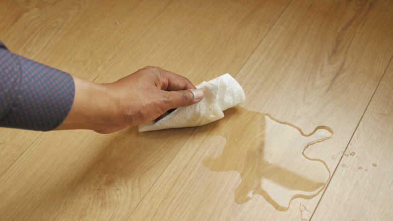 Wiping water with paper towel