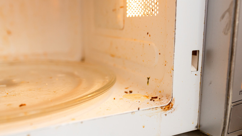 close up view of a dirty microwave