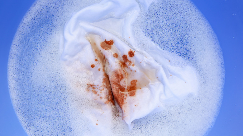 stained white shirt soaking in water