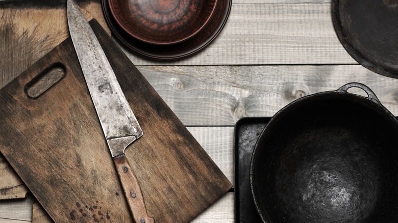 Kitchen tools on wooden background