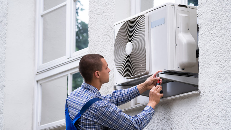 Professional installation of an AC unit.