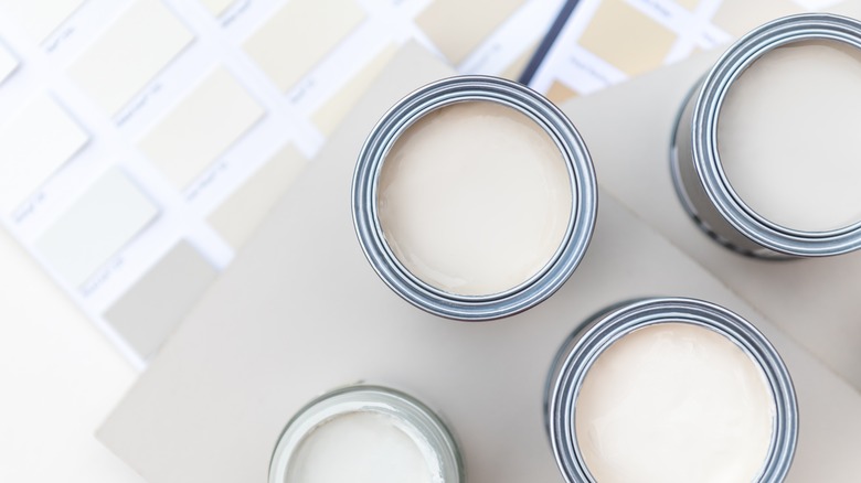 White and gray paint cans