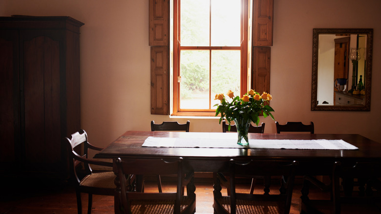 vintage dining room aesthetic with dark wood table
