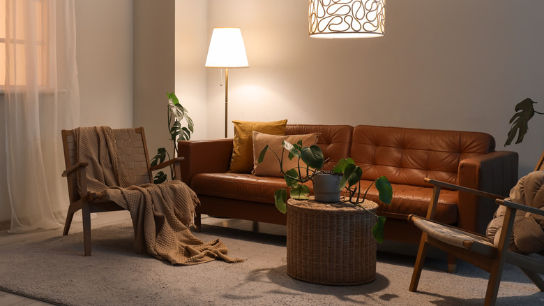 brown leather sofa in minimal cozy styled room