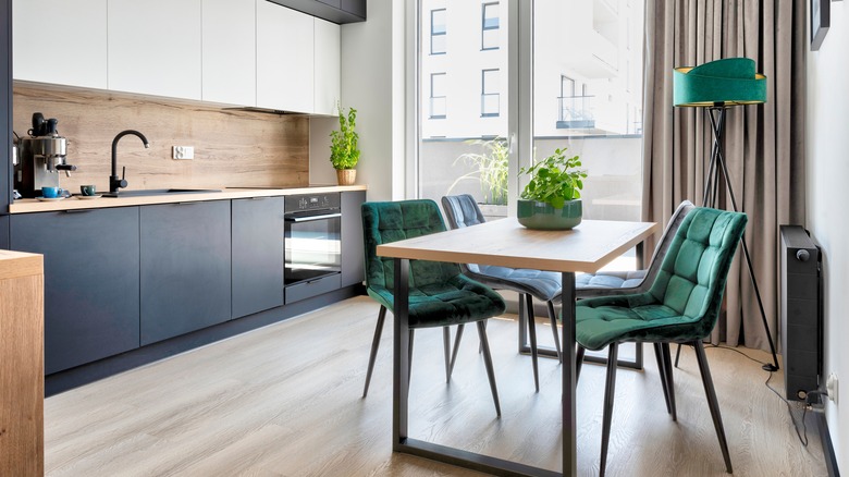 kitchen with green velvet chairs