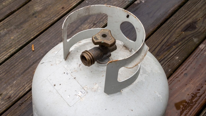 Propane tank on wooden deck