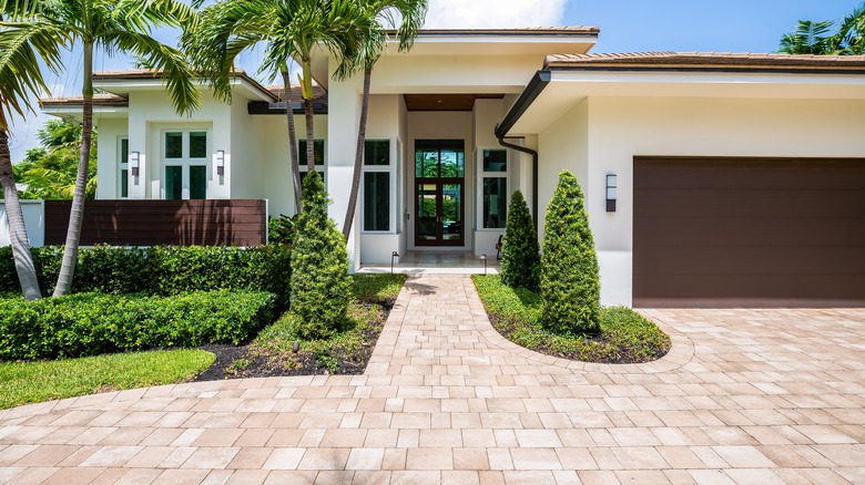 home with stone paver driveway