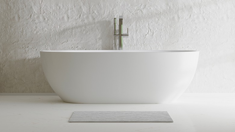 white stand alone bath tub