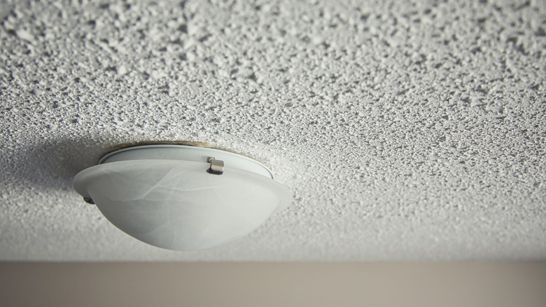 in tact popcorn ceiling with light fixture