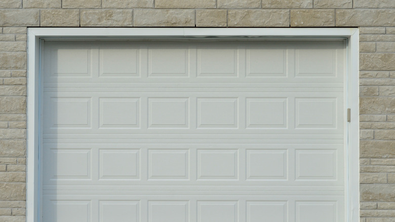 A white garage door that is closed