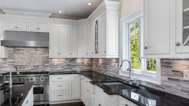 White and gray kitchen with plenty of upper cabinets