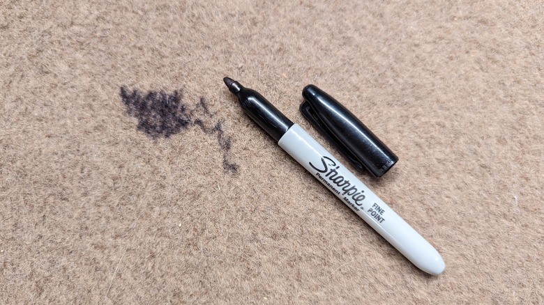 Permanent marker stain on beige carpet