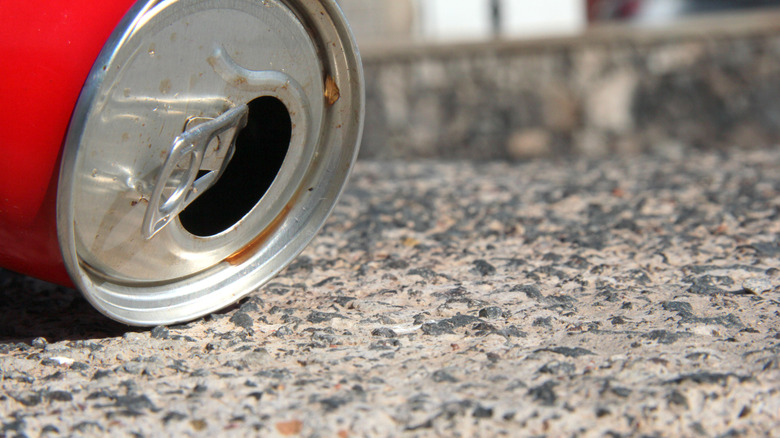 a beer can lying on the floor