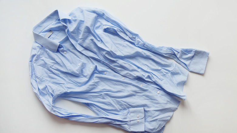 Light blue wrinkled button down shirt