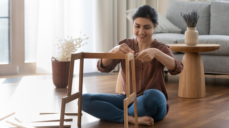 Person putting furniture together