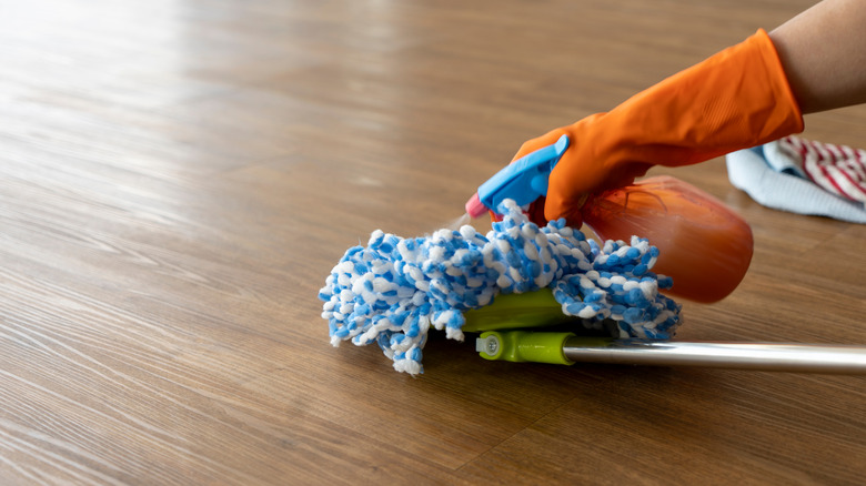 mop being sprayed 