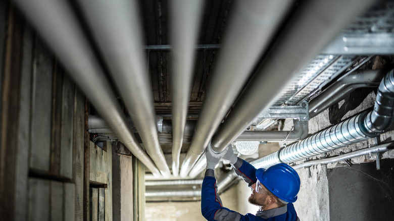 checking pipes in basement