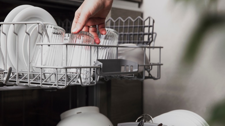 Loading dishes into dishwasher