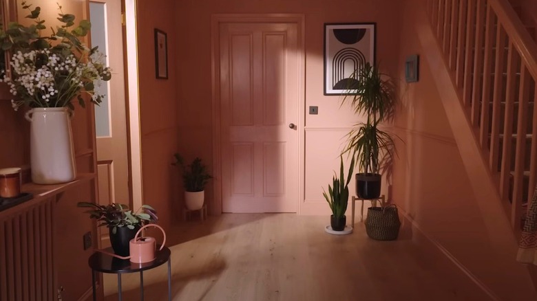 A pink color drenched entranceway
