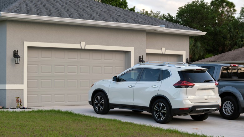 Cars in front of garage