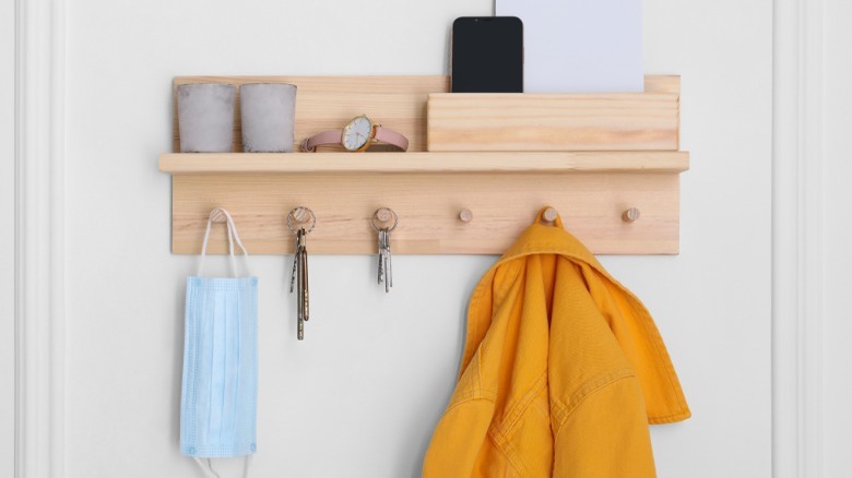 Key and coat holder, yellow coat
