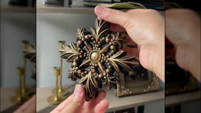 A painted plastic Dollar Tree ornament looks like an antique