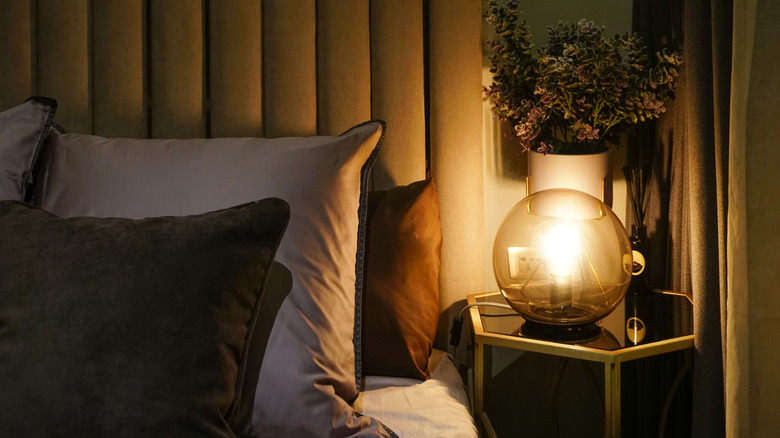 A bedroom with warm globe lighting